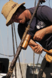 Amistad first mate Scott Spilllias works on the Adventure's rigging